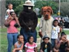 National Night Out - Smokey the bear and Mcgruff pose with large group