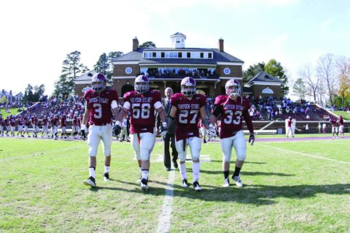 Football players walking to the coin toss